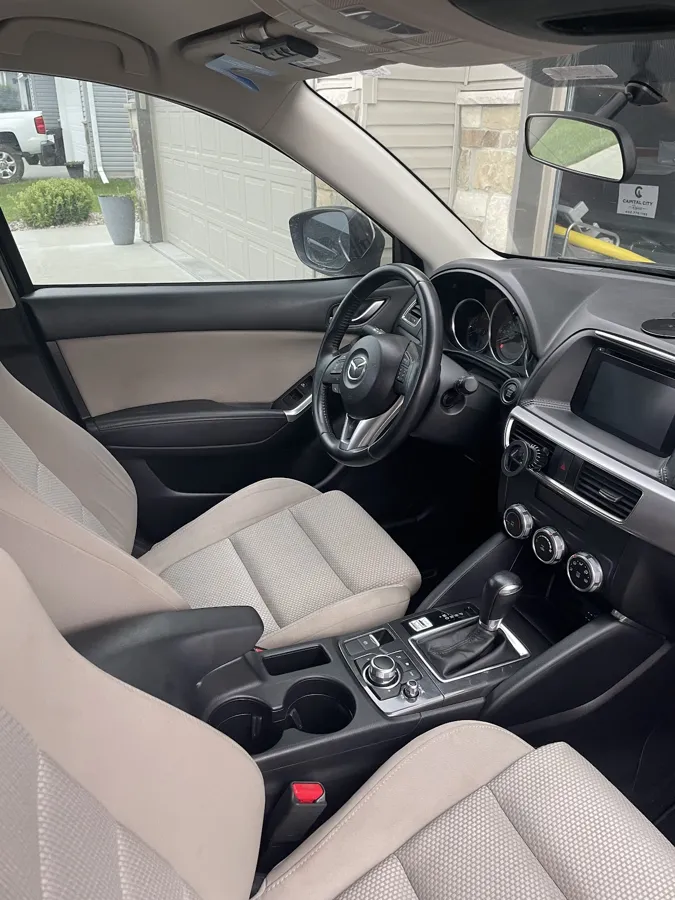 Clean cloth seats and dashboard after a mobile interior detail in Lincoln